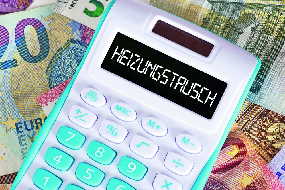 © Stadtratte / iStock / Getty Images Plus via Getty Images Taschenrechner und Geldscheine