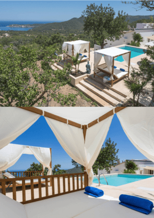 Zwei mit Stofftüchern beschattete Liegepavillons neben einem Swimmingpool, an einem Abhang mit Blick auf die hügelige Landschaft Ibizas und auf das Meer