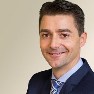 Portraitfoto von Michael Allesch, Direktor Marketing und Vertrieb von Isover und Rigips